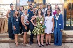 Hispanic Alumni pose at an event.