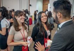 Students listening to an alum